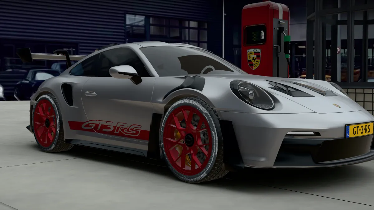 De zilveren 911 GT3 RS met rode velgen en GT3 RS-belettering, schuin van voren