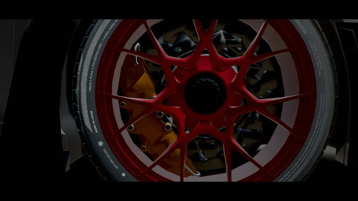 Close-up van een rode velg van de 911 GT3 RS met remklauw, de achtergrond onscherp